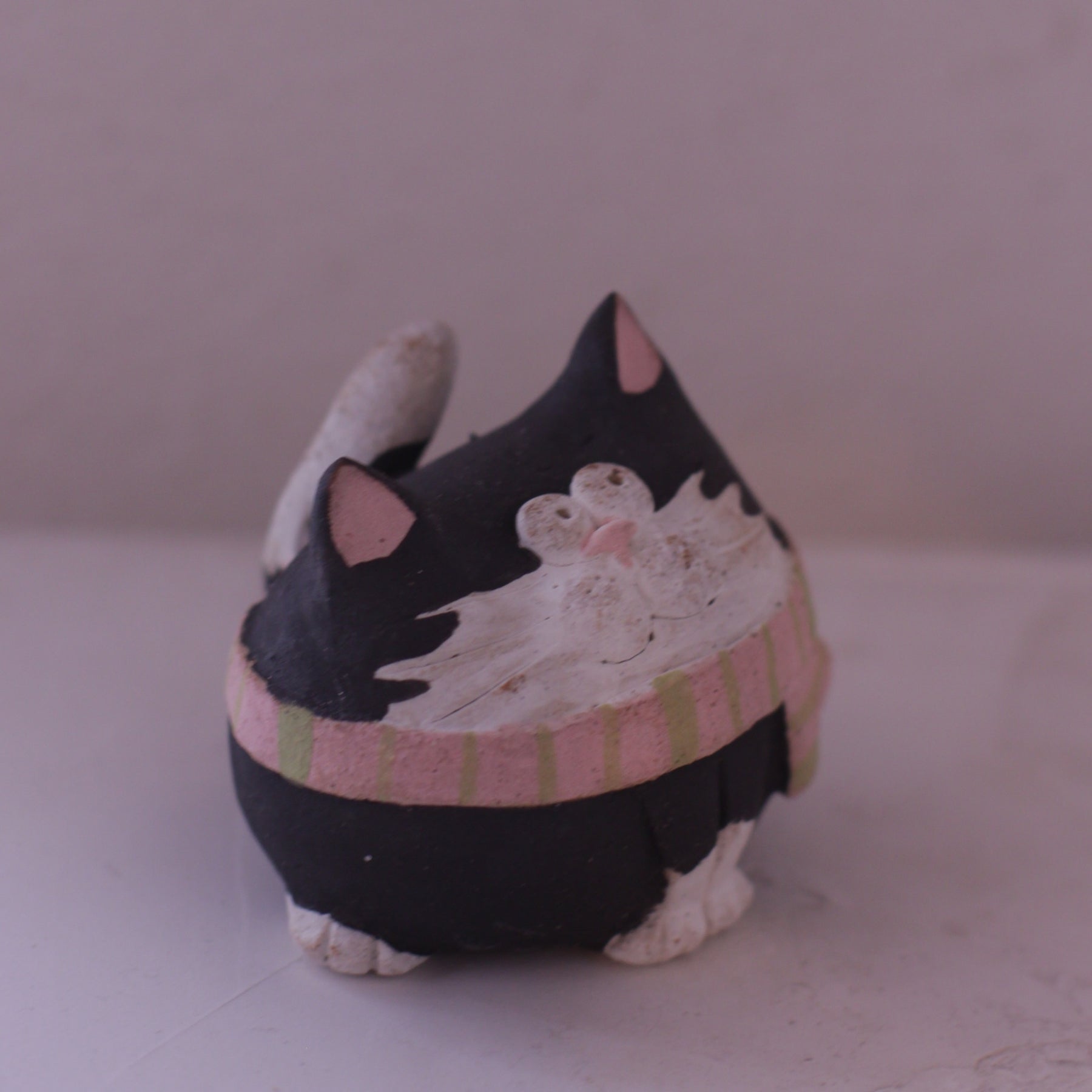Handmade Clay Cat Figurine in black and white with pink ears and striped scarf by various artist