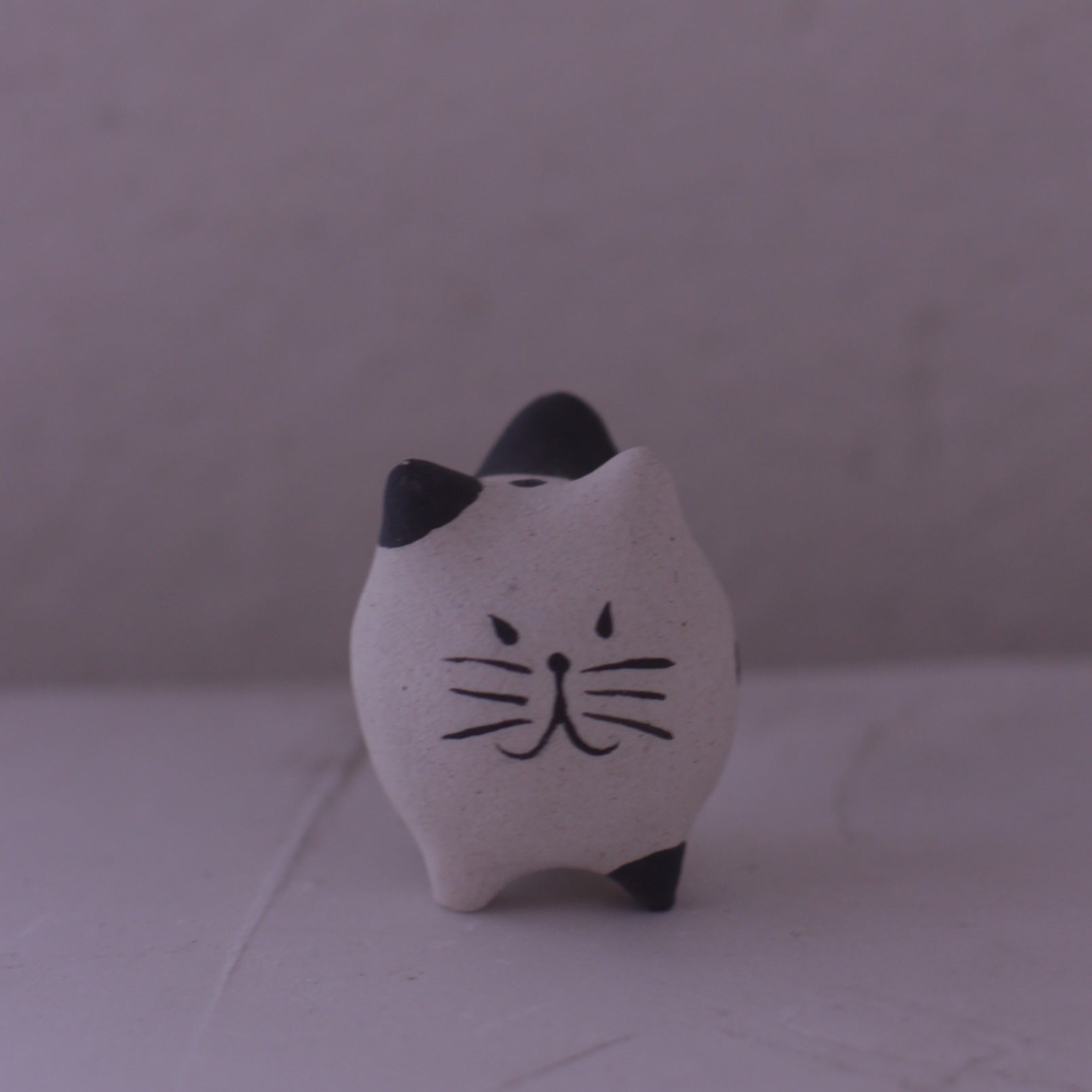 Handmade Clay Cat Figurine with black ears and whiskers by various artist in pottery style