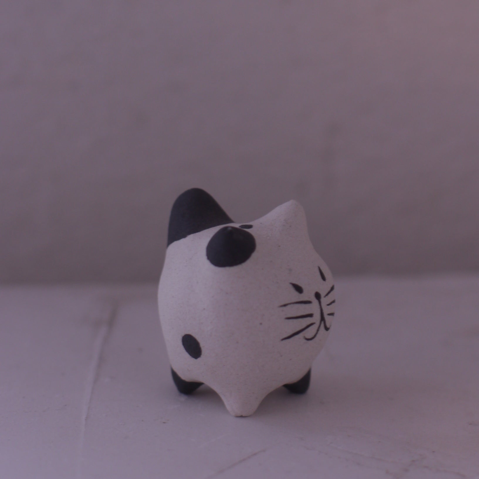 Handmade Clay Cat Figurine in white with black spots crafted by various artists