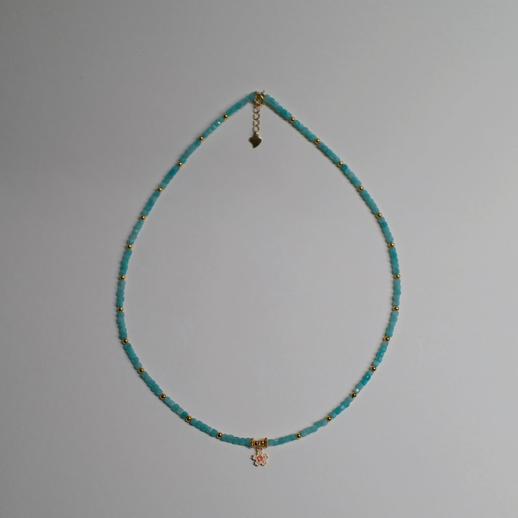 Colorful Necklace by ARCHEAST featuring turquoise beads and gold accents with a flower charm pendant