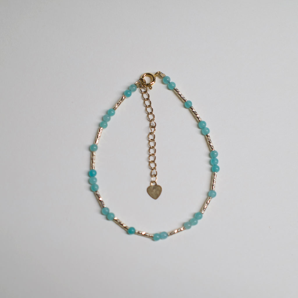 Colorful Necklace by ARCHEAST featuring turquoise beads and gold chain with heart charm
