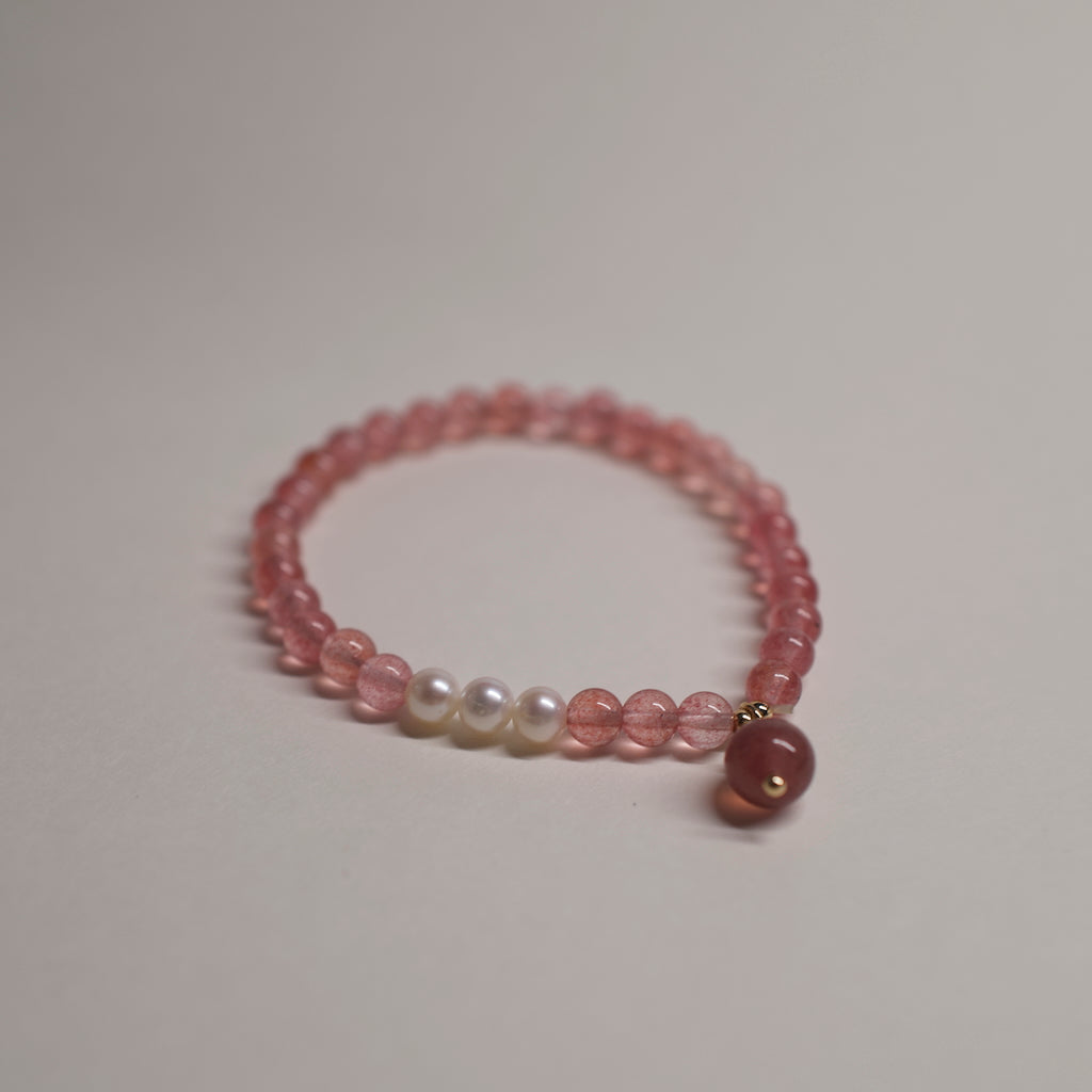 AuroraGems colorful necklace by ARCHEAST with pink and white beads on a neutral background