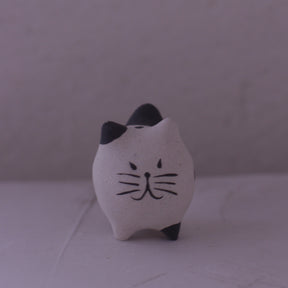 Handmade Clay Cat Figurine with black ears and whiskers by various artist in pottery style
