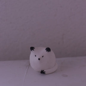 Handmade clay fox figurine with black painted details by various artist in pottery style