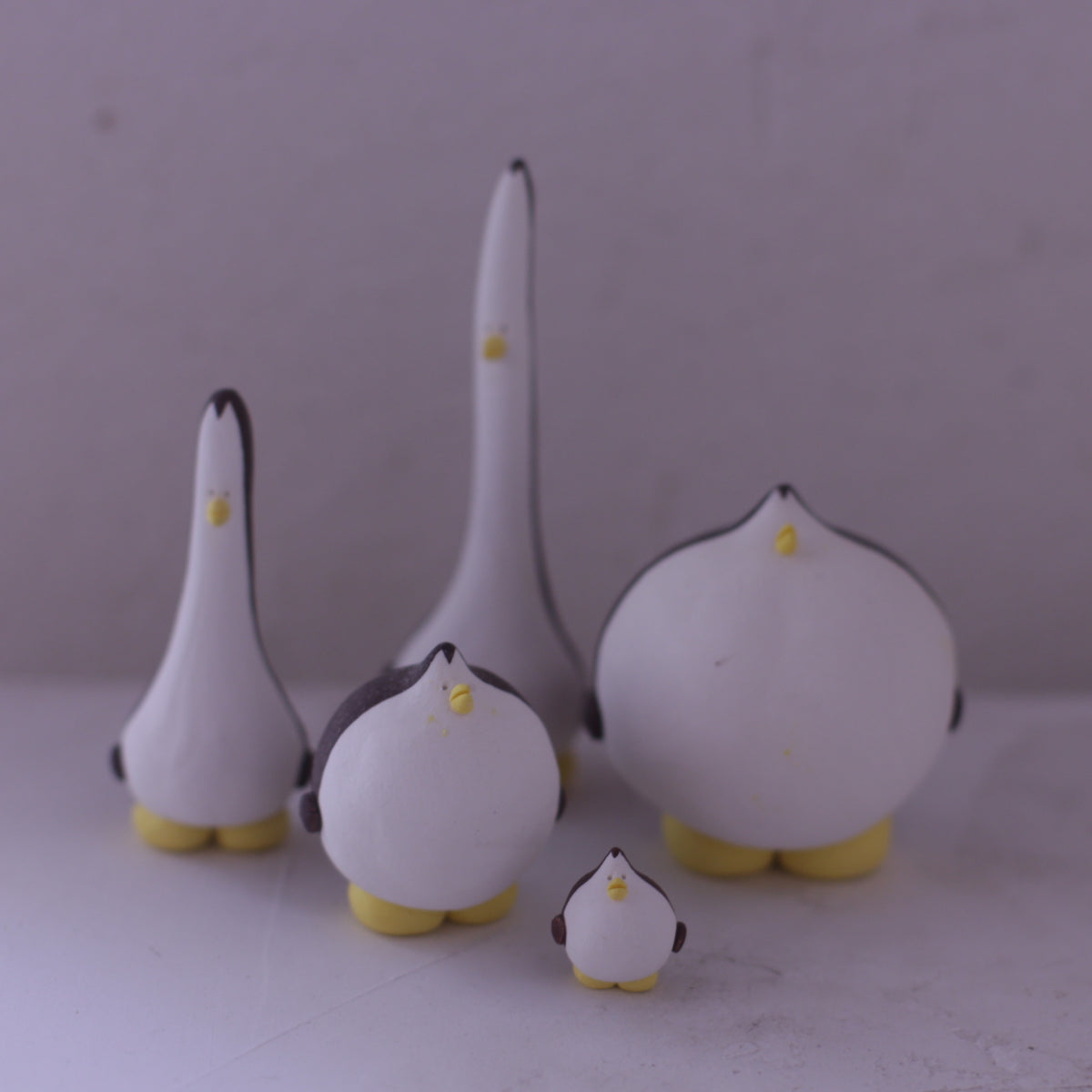 Set of handmade pottery animal figurine in white and yellow with various bird shapes by various artists