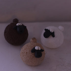 Handmade pottery animal figurine set of three sheep in brown, beige, and white colors